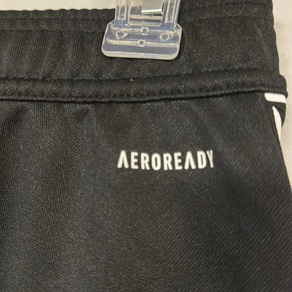 Adidas Aeroready track pants,  Adidas name graphic  1 side, stripes on other, S